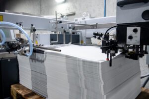 Large stack of large format printed paper